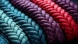 The intricate fibers of braided ropes intertwine like a colorful thread, tied together in a complex knot that symbolizes strength, unity, and the wild spirit of adventure