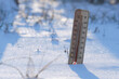 Outdoor thermometer street in snow with low sub zero temperature in sunny frosty weather.