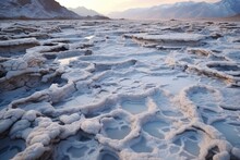 Complex Patterns Of Frozen Salt Flats In A Cold Desert At Dusk