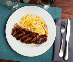 Wall Mural - Portion of fried potatoes with beef tenderloin steak