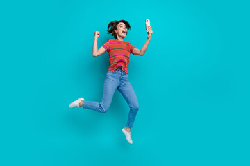 Poster - Photo of overjoyed crazy cheerful girl wear stylish clothes celebrating success yes hooray isolated on cyan color background