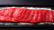 Raw fresh entrecote meat from ribeye steak on a board with salt. Dark background. Generative AI
