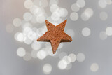 Fototapeta  - A wooden star on a beautiful, elegant background