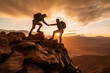 Hiker couple shaking hands on the top of the mountain during sunrise