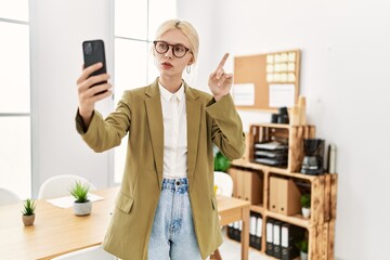 Poster - Young blonde woman business worker having video call at office