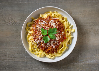 Wall Mural - bowl of pasta tagliatelle with bolognese sauce