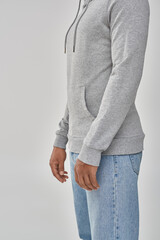 stylish african american man in gray casual sweatshirt and jeans, copy space for advertising