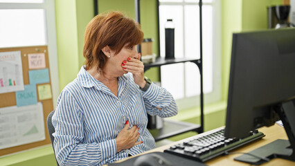 Sticker - Middle age woman business worker using computer coughing at office