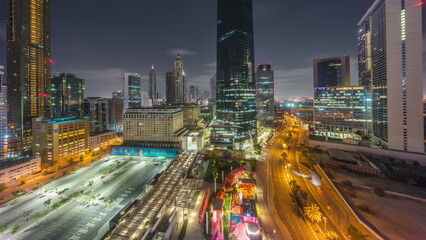 Wall Mural - Dubai International Financial district aerial all night timelapse. Panoramic view of business and financial office towers.