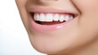 © masyastadnikova - Beautiful woman's smile with healthy white, straight teeth close-up on light background with space for text