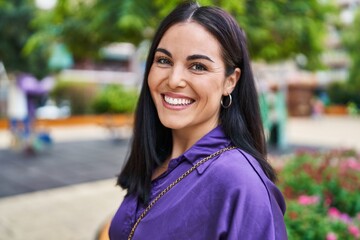 Canvas Print - Young beautiful hispanic woman smiling confident standing at park