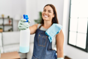 Sticker - Young beautiful hispanic woman smiling confident holding diffuser at home