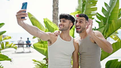 Poster - Two men couple smiling confident having video call at park