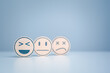 Wooden labels with happy normal and sad face icons for experience survey services and products review concept. Customer or Client choose Good, Neutral, or Negative feedback and satisfaction rating.