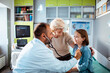 © Davor - Doctor with stethoscope examining little girl patient with grandmother