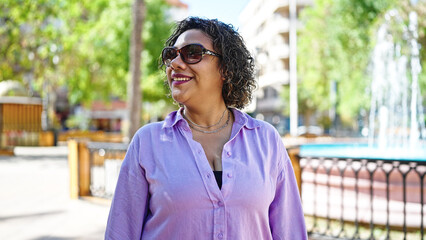 Poster - Young beautiful latin woman smiling confident standing at park