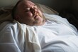 Close up of overweight patient in hospital gown waiting for medical examination,