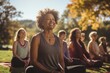 © sirisakboakaew - Multi generational women doing yoga exercise at park