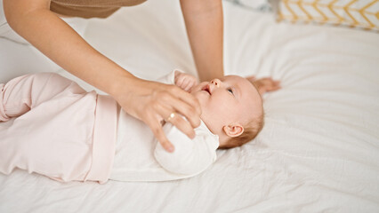 Sticker - Mother and daughter lying on bed together at bedroom