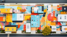 An Overhead View Of A Vibrant, Geometric Street Mural Painted In Bold Colors