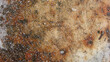 Grunge rusty worn orange brown metal corten steel stone background texture. Use for wallpaper, background.