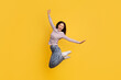 © Prostock-studio - Carefree joyful young asian woman jumping in the air