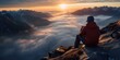 Hiker drinking coffee on a mountain peak with a breathtaking sunrise light view