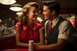People have a dinner in american diner of 1950s