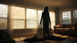 Dark hooded figure in living room - depression and anxiety concept