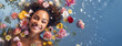 Portrait of a young, smiling woman lying in shallow water with floating flowers. Skin care beauty, skincare cosmetics, spa concept. copy space.