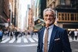 © NikoG - Portrait of a happy senior businessman in the city