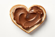 Heart shaped toast with chocolate cream on white background. Top view. Valentines day food concept