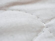 Fabric texture with stitched thread close-up macro selective focus fabric theme