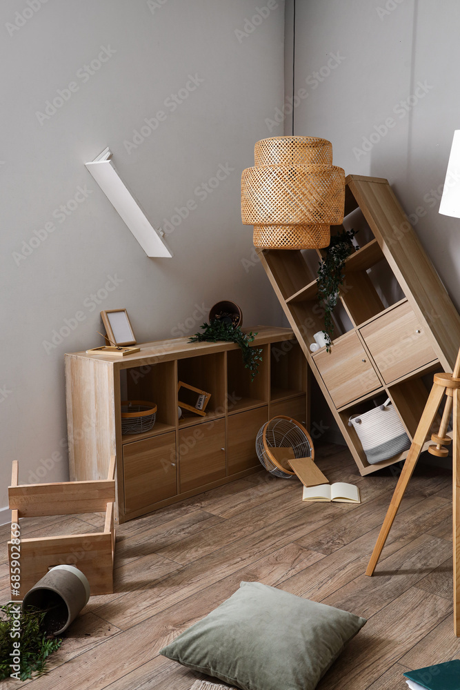 Shelving units with stepladder in messy living room