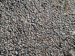 Wall Mural - Gravel in the form of small gray stones close-up. Top view, copy space.