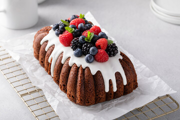 Wall Mural - Chocolate cake with cream cheese frosting and fresh berries