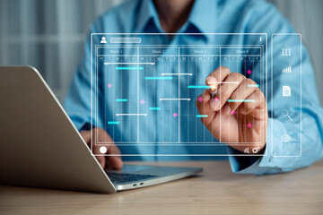 Businessman working with Gantt chart schedule , with a planning software, Corporate strategy for finance, operations, sales, marketing.