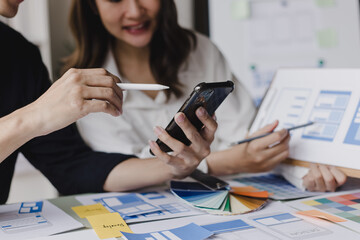 Business teamwork and working with UX developer and UI designer at table in modern office. Creative and development agency concept.