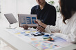 © SOMKID - Business teamwork and working with UX developer and UI designer at table in modern office. Creative and development agency concept.