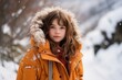 Portrait of a beautiful little girl in the winter forest. Winter fashion.