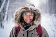 Portrait of a smiling woman in the winter forest. Winter holidays.