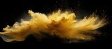 Explosion of small sand wave of golden grains abstract flying cloud yellow silica splash isolated black high speed shot Copy space image Place for adding text or design