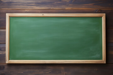 blank green chalkboard with wood border on wooden background, education and commercial concept, text space.