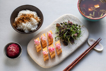 Wall Mural - Japanese breakfast: egg roll tamagoyaki, miso soup, herb salad and rice