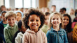 © Renata Hamuda - Portrait of cheerful smiling school children standing posing in classroom looking at the camera