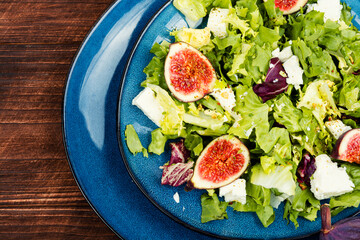 Canvas Print - Dietary salad with figs, herbs and cheese.