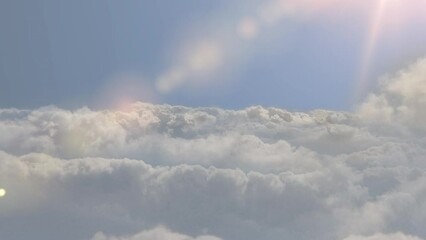 Wall Mural - cinematic breathtaking aerial flying backwards through the white fluffy clouds high in the heavenly 