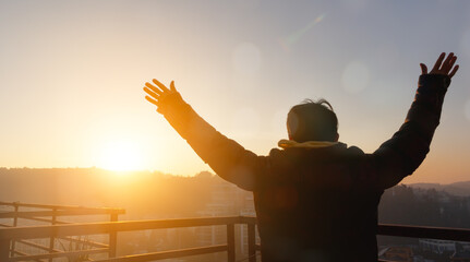 Wall Mural - human hands open palm up worship on sunset background.