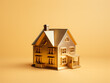 A golden house miniature model isolated on a plain background.  