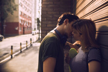 Intimate Urban Couple Embracing On City Street